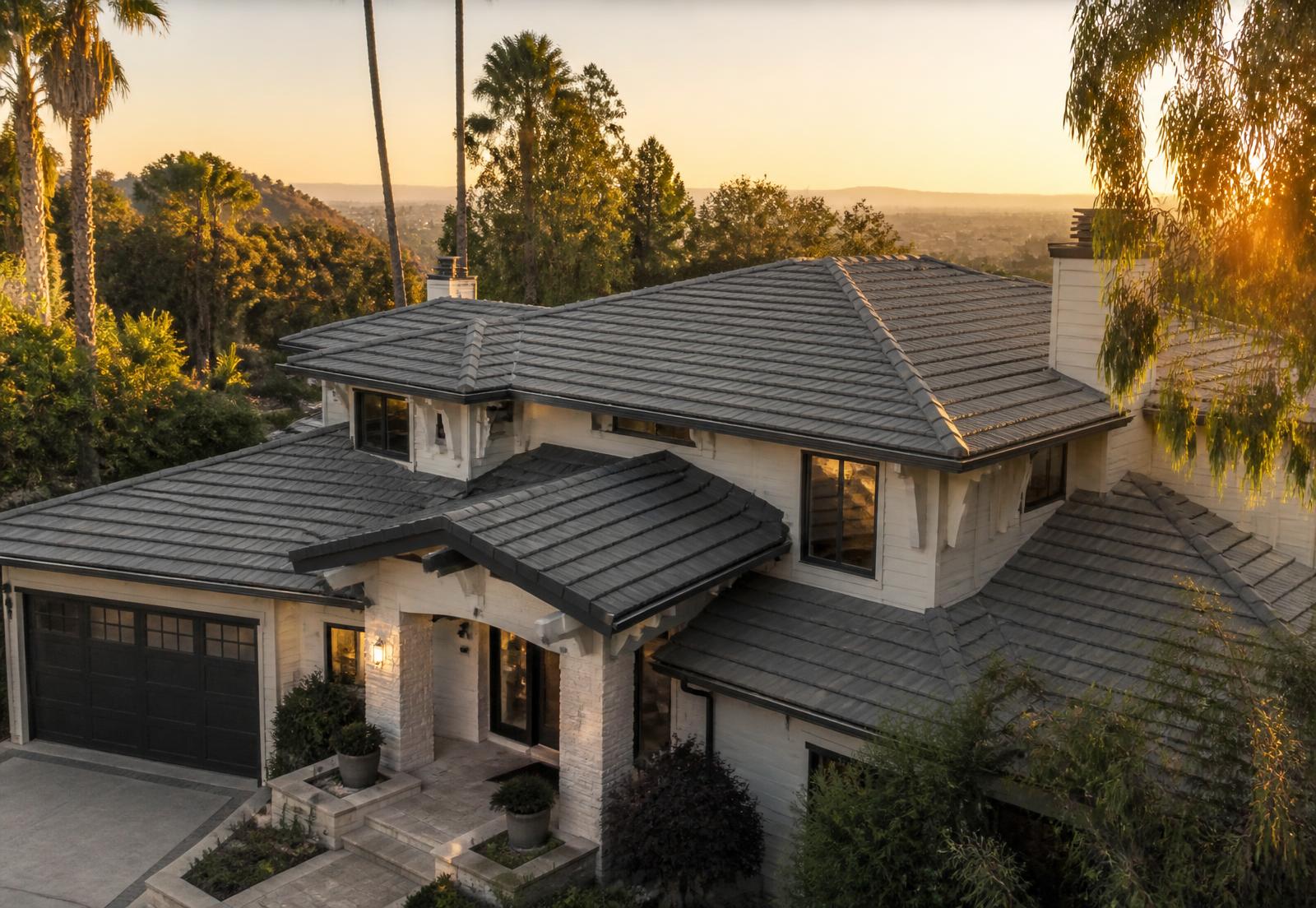 Southern California hillside home with a premium tile roof at golden hour